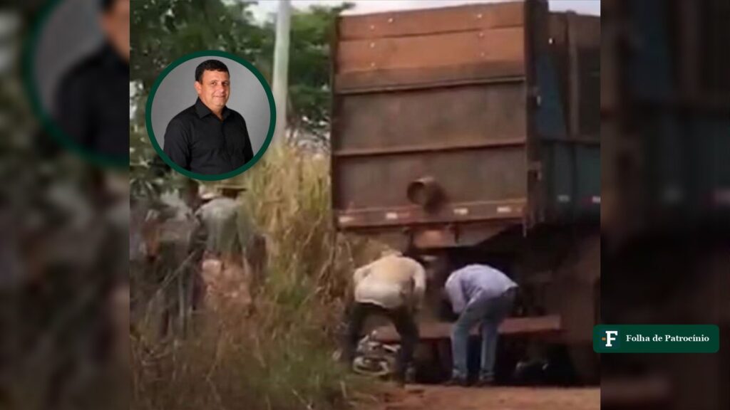 Caminhão caçamba e pessoas no local do acidente em Carmo do Paranaíba