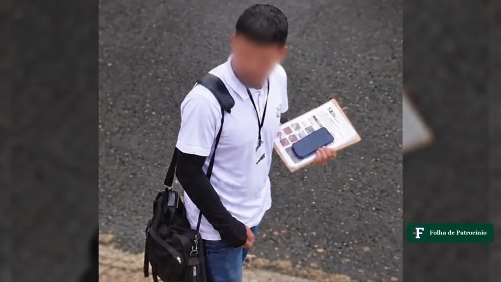 Homem de camiseta branca, crachá e prancheta em rua do Morada Nova, imagem do alerta sobre falso agente de saúde em Patrocínio